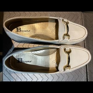 Brown’s white loafers